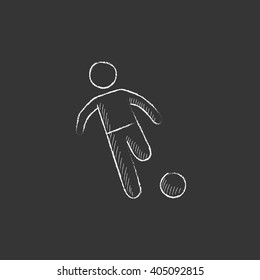 Soccer player with ball. Drawn in chalk icon.
