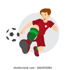 Soccer player wearing a red costume shooting a ball. Vector Image