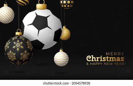 soccer Sport Christmas card. Merry Christmas sport greeting card. Hang on thread soccer world football ball as a xmas ball and golden bauble on black horizontal background. Sport Vector illustration.