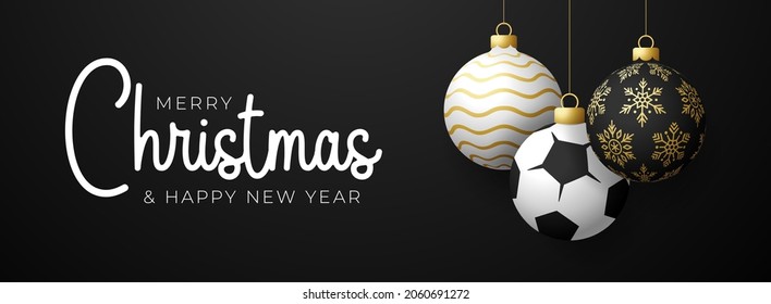 soccer Sport Christmas card. Merry Christmas sport greeting card. Hang on a thread soccer, football ball as a xmas ball and golden bauble on black horizontal background. Sport Vector illustration.