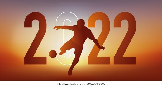 Soccer themed sport concept for a 2022 greeting card, showing a soccer player kicking the ball with his foot to score a goal.