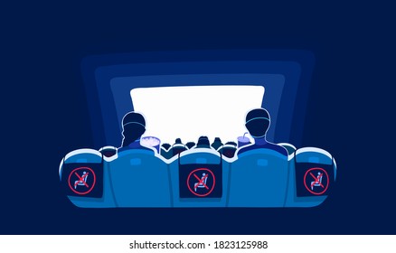 Social distance in a cinema during coronavirus. Prevention of the covid-19 virus. Movie social distancing. Empty chairs, prohibiting sign. People watch a film, view from back.