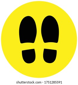 Social distancing concept for preventing coronavirus covid-19 with footprint stand here on yellow circle background