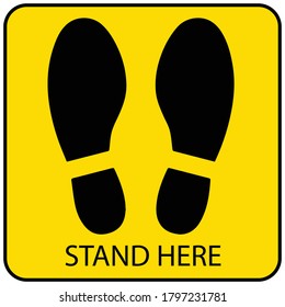 Social distancing concept for preventing coronavirus covid-19 with black footprint and wording stand here in yellow background 