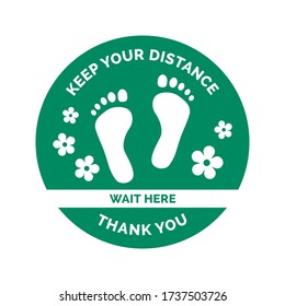 Social distancing and coronavirus covid-19 prevention: floor sticker sign with footprints and flowers