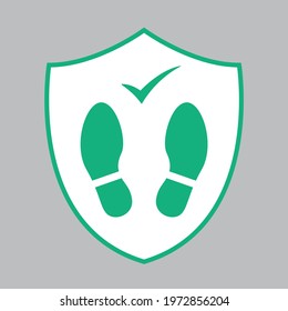 Social distancing coronavirus protection, green footprint in shield floor sticker sign