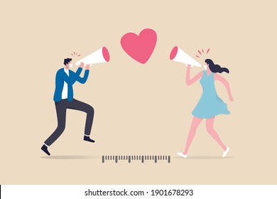 Social distancing valentine, lover couple telling I love you by keeping distance away due to COVID-19 Coronavirus concept, lovely boyfriend and girlfriend speak through megaphone with love heart shape