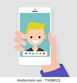 Social media icons. Reactions: thumbs up, thumbs down, emoji. Rate the photo. Millennial character. Hand holding a smartphone. Flat editable vector illustration, clip art