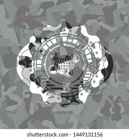 social network icon inside grey camouflage emblem
