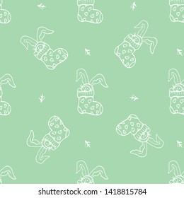 Socks and bunny rabbits seamless pattern, white outline on mint color background, vector