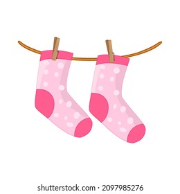 Socks hanging on rope isolated on white background. Pink socks on clothesline.Cotton or wool children sock dry and hang on laundry string with clothespins.Laundry drying icon.Stock vector illustration