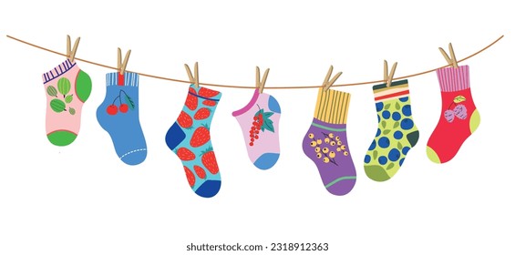 Socks on rope. Cotton or wool sock dry and hang on laundry string with clothespins. Children socks with textures and patterns vector cartoon. Illustration wool and cotton socks in rope