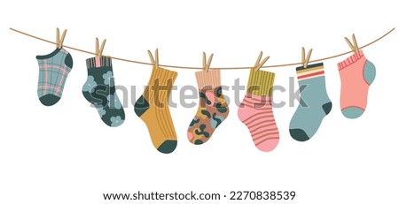 Socks on rope. Cotton or wool sock dry and hang on laundry string with clothespins. Children socks with textures and patterns vector cartoon. Illustration wool and cotton socks in rope