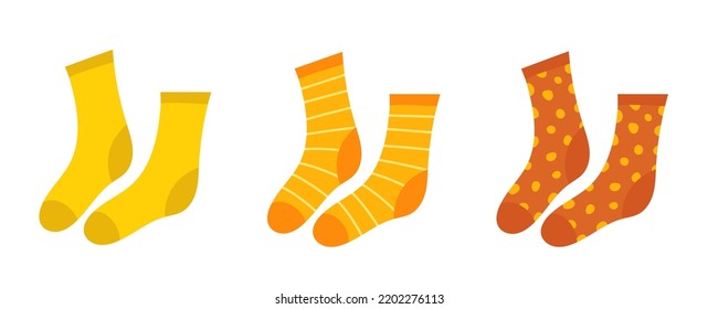 Socks. A Set Of Orange And Yellow Socks. Warm Striped And Polka Dot Socks. Vector Clipart Isolated On White Background.