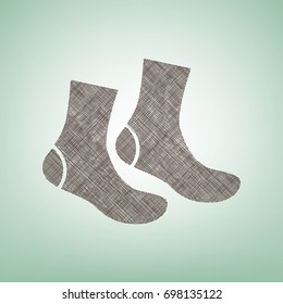 Socks sign. Vector. Brown flax icon on green background with light spot at the center.