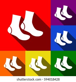Socks sign. Vector. Set of icons with flat shadows at red, orange, yellow, green, blue and violet background.