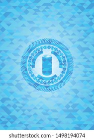 soda can icon inside light blue emblem with mosaic background