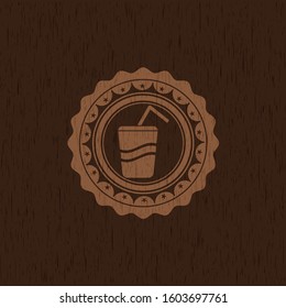 soda icon inside badge with wood background