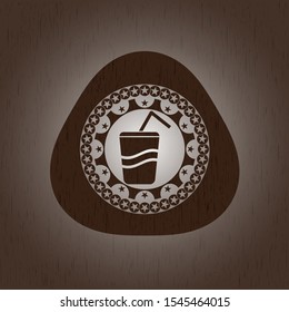 soda icon inside badge with wooden background