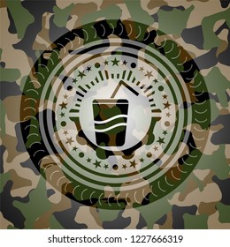 soda icon inside camouflaged emblem