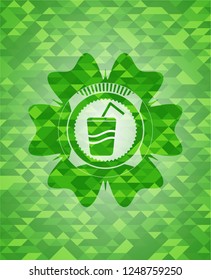 soda icon inside green emblem. Mosaic background