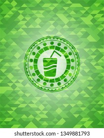 soda icon inside green emblem. Mosaic background