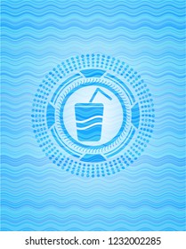 soda icon inside light blue water emblem background.