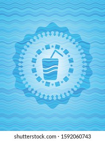 soda icon inside light blue water wave style badge.