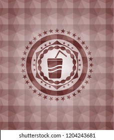 soda icon inside red seamless emblem with geometric pattern.