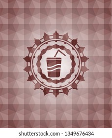 soda icon inside red seamless emblem with geometric pattern background.