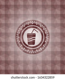 soda icon inside red seamless emblem or badge with geometric pattern background.