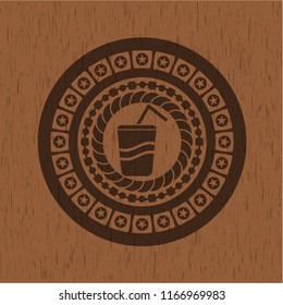 soda icon inside retro wooden emblem