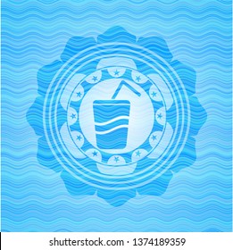soda icon inside water wave concept badge.