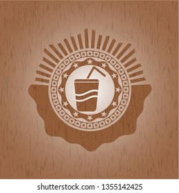 soda icon inside wooden emblem