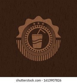 soda icon inside wooden emblem