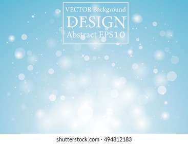 Soft Blue sparkles glitter and rays lights bokeh abstract holiday background/texture.