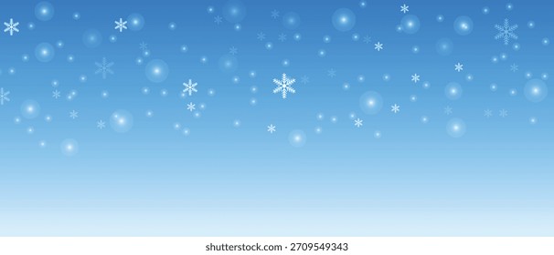weicher blauer Winterhintergrund mit fallenden weißen Schneeflocken und glänzenden Lichtteilchen
