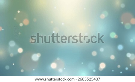Soft ethereal abstract blurred background with blue green gradient and glowing bokeh lights. Dreamy illumination fades into cooler tones creating a luminous decorative design