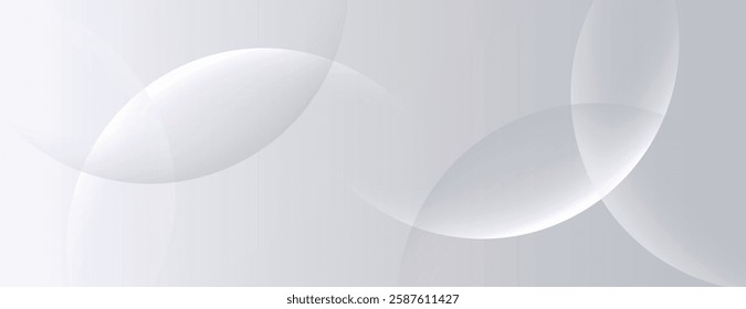 A soft gray background with overlapping translucent circles. The gray background has a smooth, minimalist texture, enhancing the gray tones. Minimal abstract circles vector gradient background