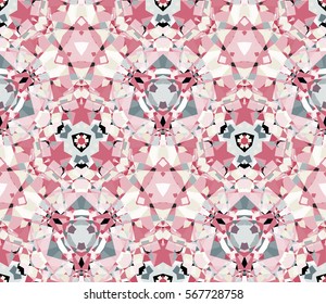 Soft kaleidoscope seamless pattern. Composed of color abstract shapes. Useful as design element for texture and artistic compositions.