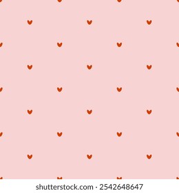 Soft seamless pattern with red hearts for Valentine's Day. Gift print for the celebration of love. Small hearts on a pink background for textiles, gift wrap, and design. Heart ornament