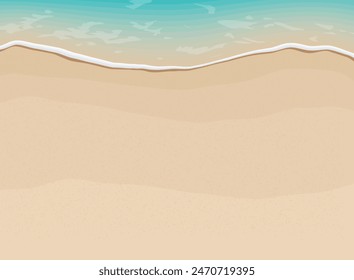 Soft waves with foam of blue ocean on the sandy summer beach.