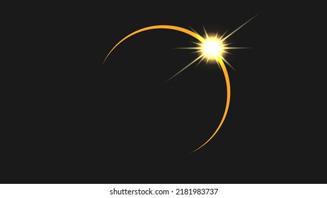 A solar eclipse with a glare from the appearing sun.