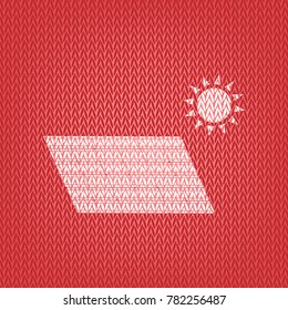 Solar energy panel. Eco trend concept sign. Vector. Knitted white icon on a red knitted background.