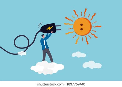 Solar sunlight energy, ecology natural power and energy to save the world concept, engineer solar technology worker holding electric plug to plug into the sun idea to get sustainable electricity.