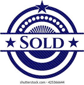 Sold emblem with denim high quality background