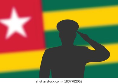 Solder silhouette on blur background with Togo flag. Template for memorial day