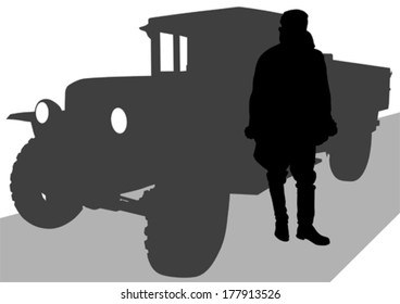 Soldier at old military truck