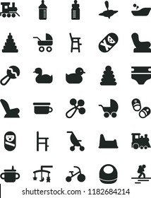 solid black flat icon set toys over the cradle vector, mug for feeding, bottle, measuring, diaper, baby bib, beanbag, rattle, chair, car child seat, stroller, carriage, summer, rubber duck, duckling