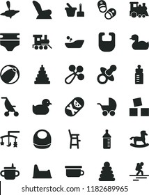 solid black flat icon set toys over the cradle vector, dummy, mug for feeding, bottle, measuring, diaper, bib, baby, rattle, car child seat, stroller, summer, rubber duck, duckling, bath ball, toy